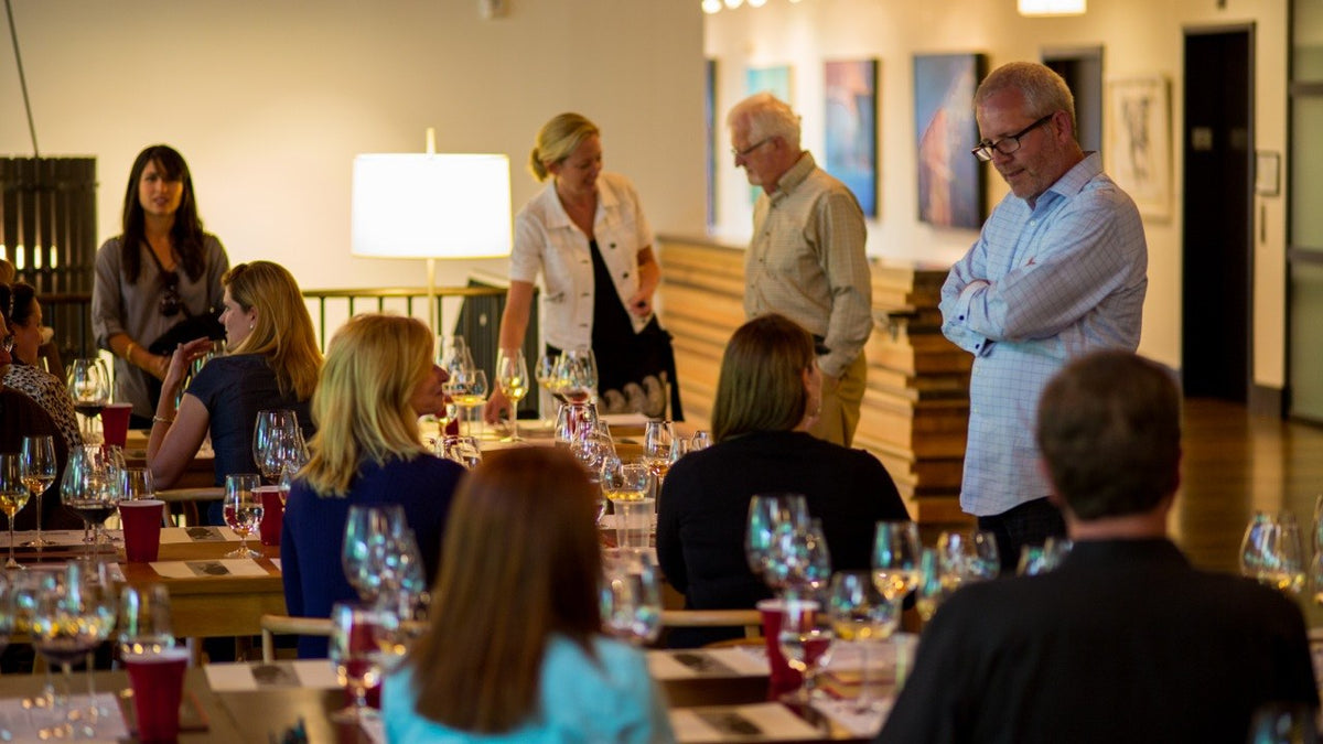 An early Napa Valley Wine Academy class at St. Supéry Winery, with co-founders Catherine Bugué, Jürg Oggenfuss and Christian Oggenfuss standing at the front