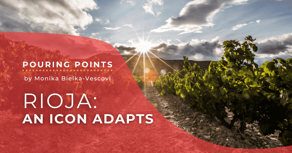 Napa Valley Wine Academy Wine Articles  Sun shining through clouds over a vineyard, highlighting green grapevines and trellises under a bright sky.