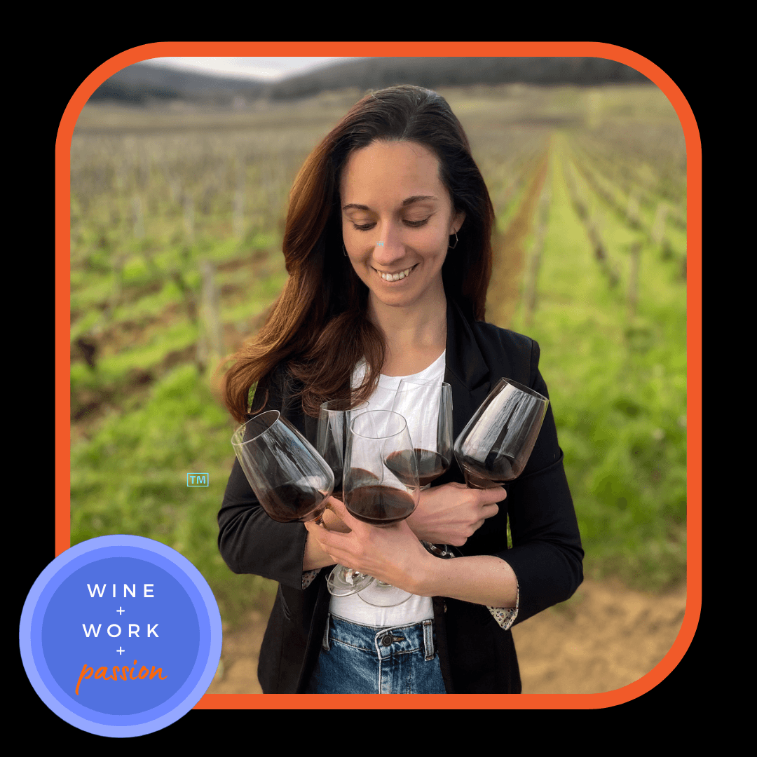 Napa Valley Wine Academy Wine Articles  A woman smiling and holding wine glasses in a vineyard.