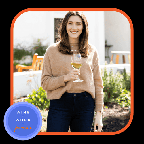 Napa Valley Wine Academy Wine Articles and Podcasts A woman wearing blue jeans smiles while holding a glass of wine.