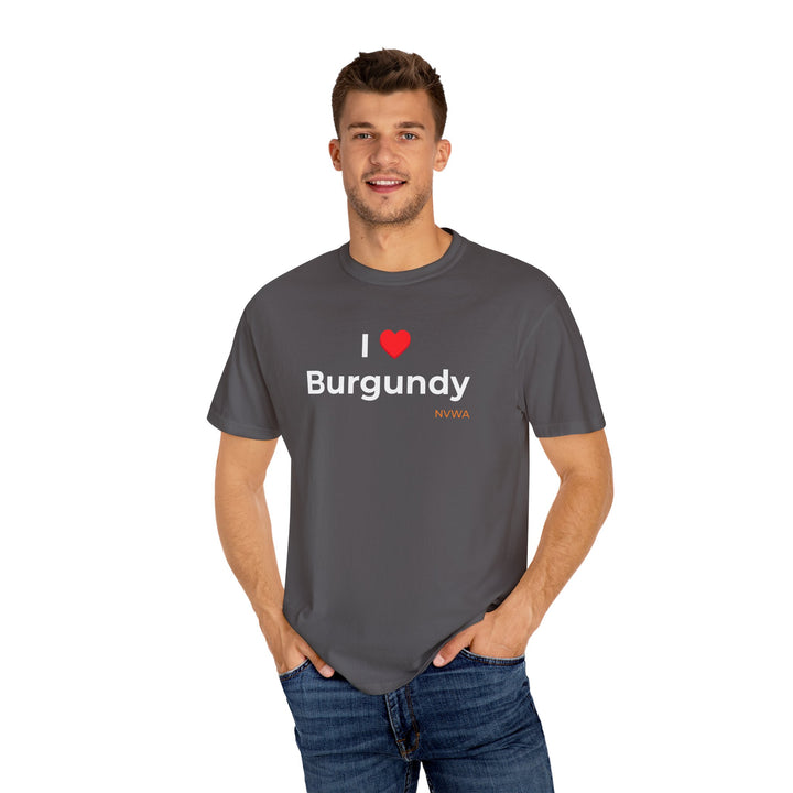 NVWA T-shirt “I ❤️ Burgundy” featuring a wine geek saying, worn by a smiling man in jeans, showcasing its casual and versatile style.