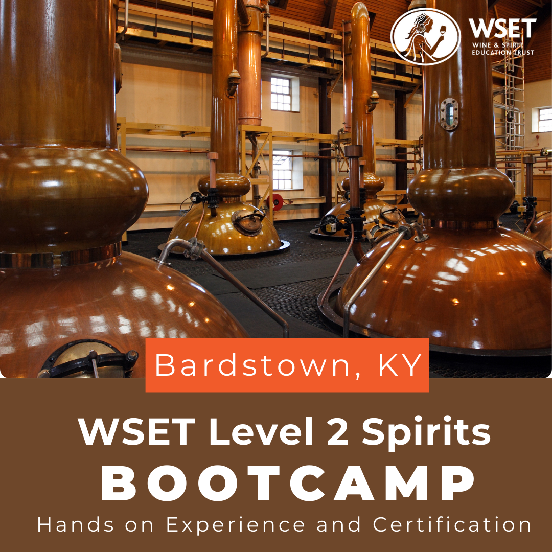 WSET Level 2 Spirits Bootcamp: copper tanks in a distillery with a logo of a woman holding a glass of wine, representing distillation and maturation practices.