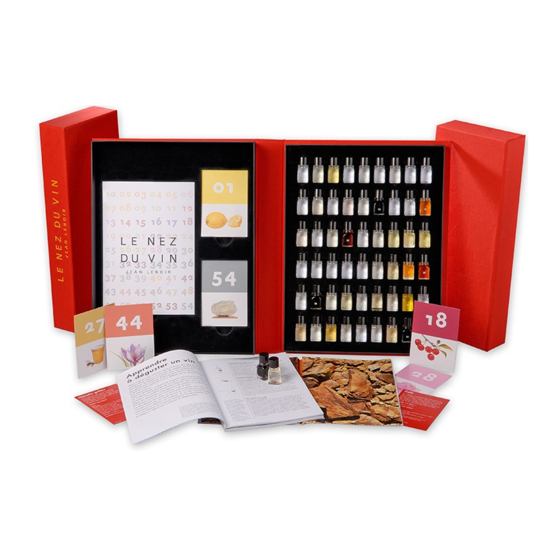 Le Nez du Vin 54 Wine Aroma Master Kit featuring a red case with 54 perfume bottles and a guidebook for wine aroma identification.