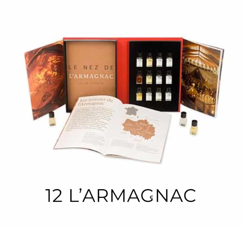 12 AROMA – ARMAGNAC KIT featuring an open book and a box containing small bottles, highlighting the scents and stories of Armagnac's rich history.