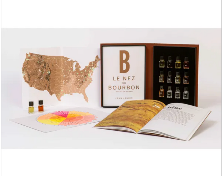 12 Bourbon and American Whiskey Aroma Kit - Le Nez du Vin, featuring a map, an open guidebook, and essential oil bottles representing key whiskey aromas.